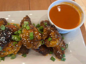 Grilled Wings with Jamaican Jerk Seasoning and Tossed in Global Wok's Sesame Buffalo Signature Wing Sauce!  Simply THE BEST! 